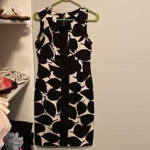 Love this dress for the office. Very flattering on all body types. Like new